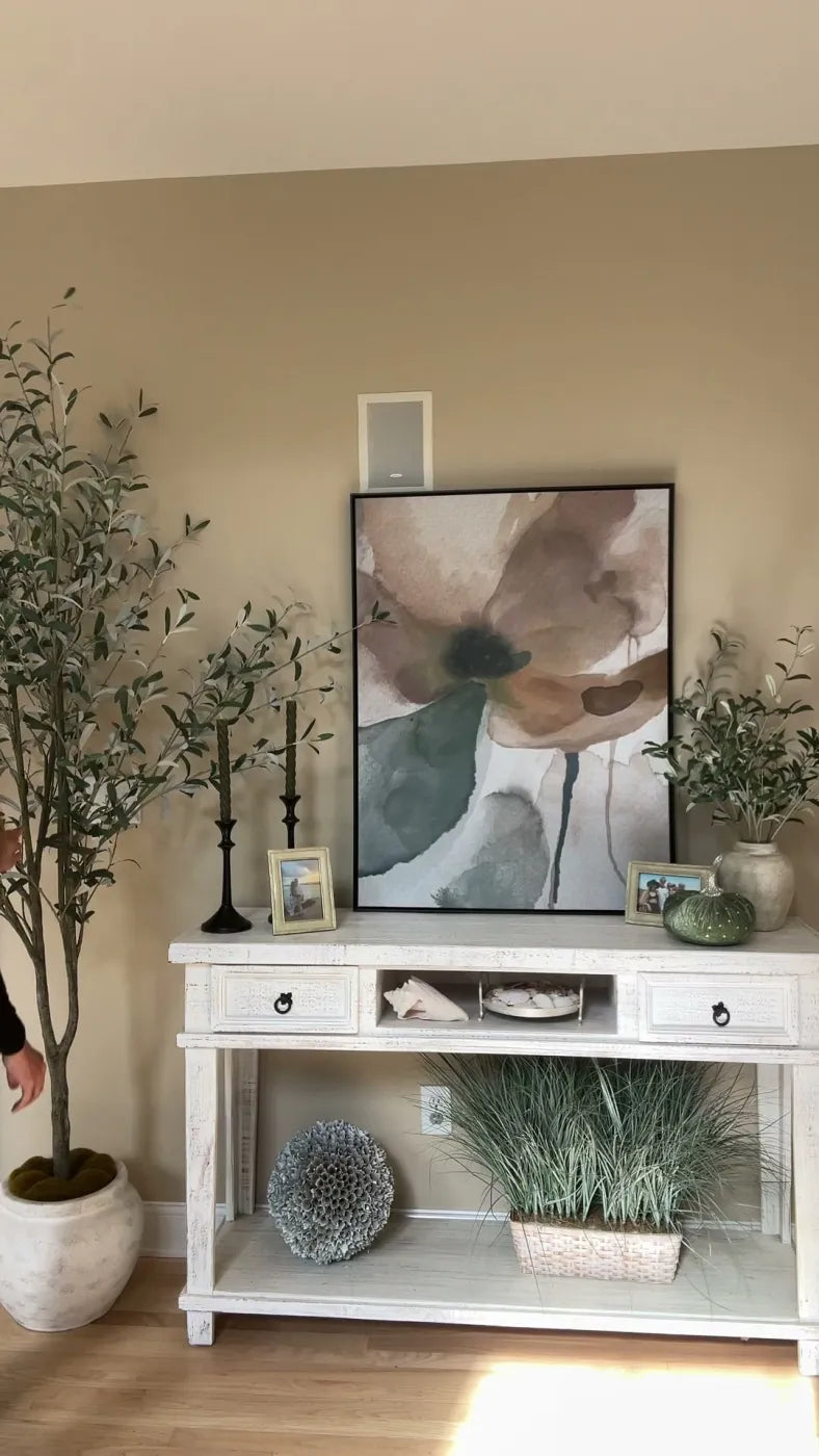 Clock Canvas framed watercolor flower art on a customer's console table